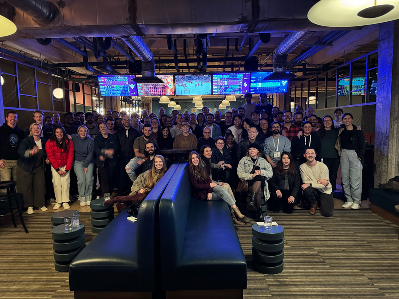 Group photo of diverse individuals in casual clothing.